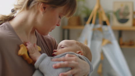 mom rocking baby to sleep