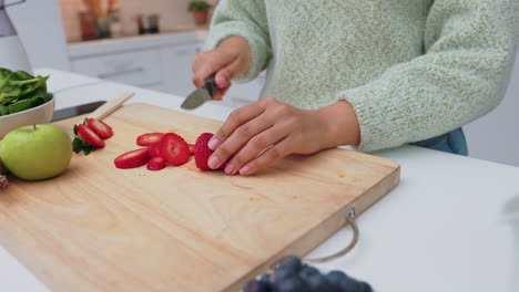 hands, fruit and diet with a knife in the hand