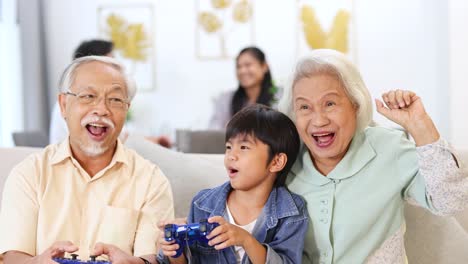 grandparents and grandchild enjoy a video game together, creating joyful memories in a cozy living room setting