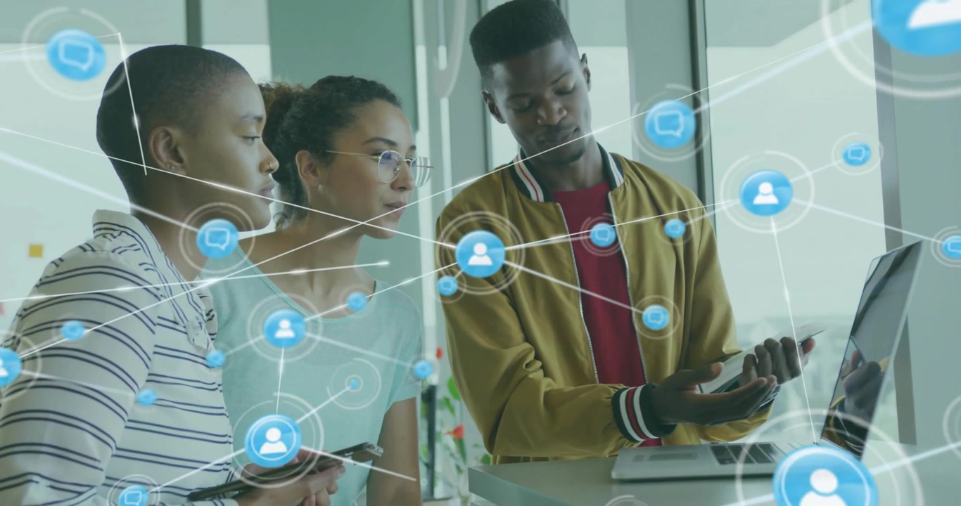 Man pointing at laptop starting tech net overlay fading as team following nodes for presentation