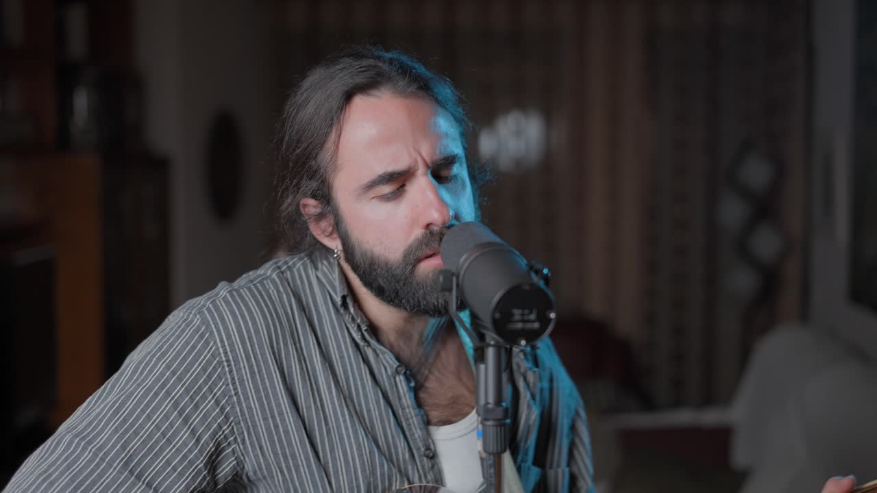 Man playing acoustic guitar and singing