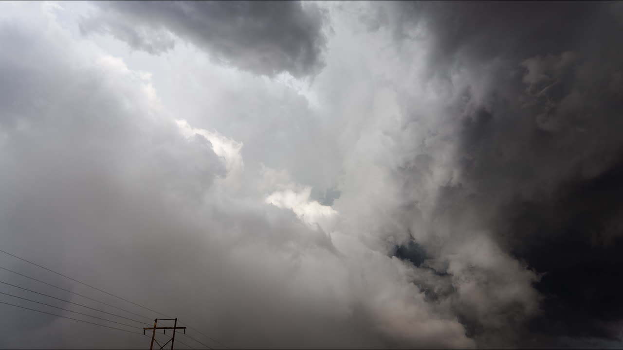 Dramatic storm clouds with power lines