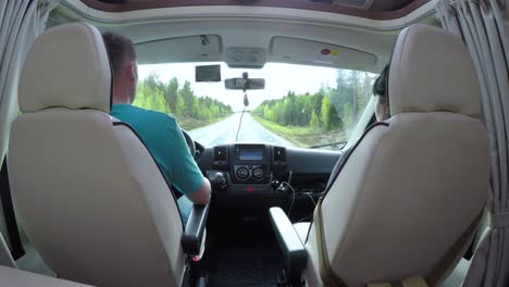 man driving on a road in the camper van rv