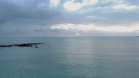Drone-footage-of-a-seascape-with-a-small-boat