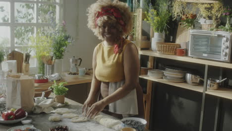 woman preparing dough in a home kitchen
