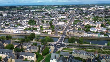 le mans cityscape with bridge and sarthe river flowing in france