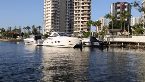 a yacht approaches and docks at a marina