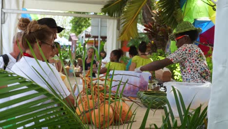 mahe, seychelles, 22.09.24, tourism festival week 2024, in town victoria, tourist buying local chips in kiosk 30fps 1