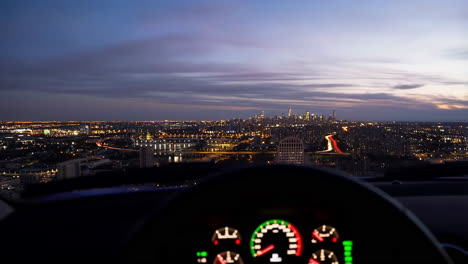 Night City View from Car Dashboard