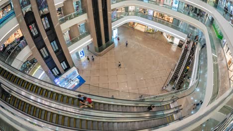 timelapse view of shoppers at luxury shopping centre complex in hong kong, china