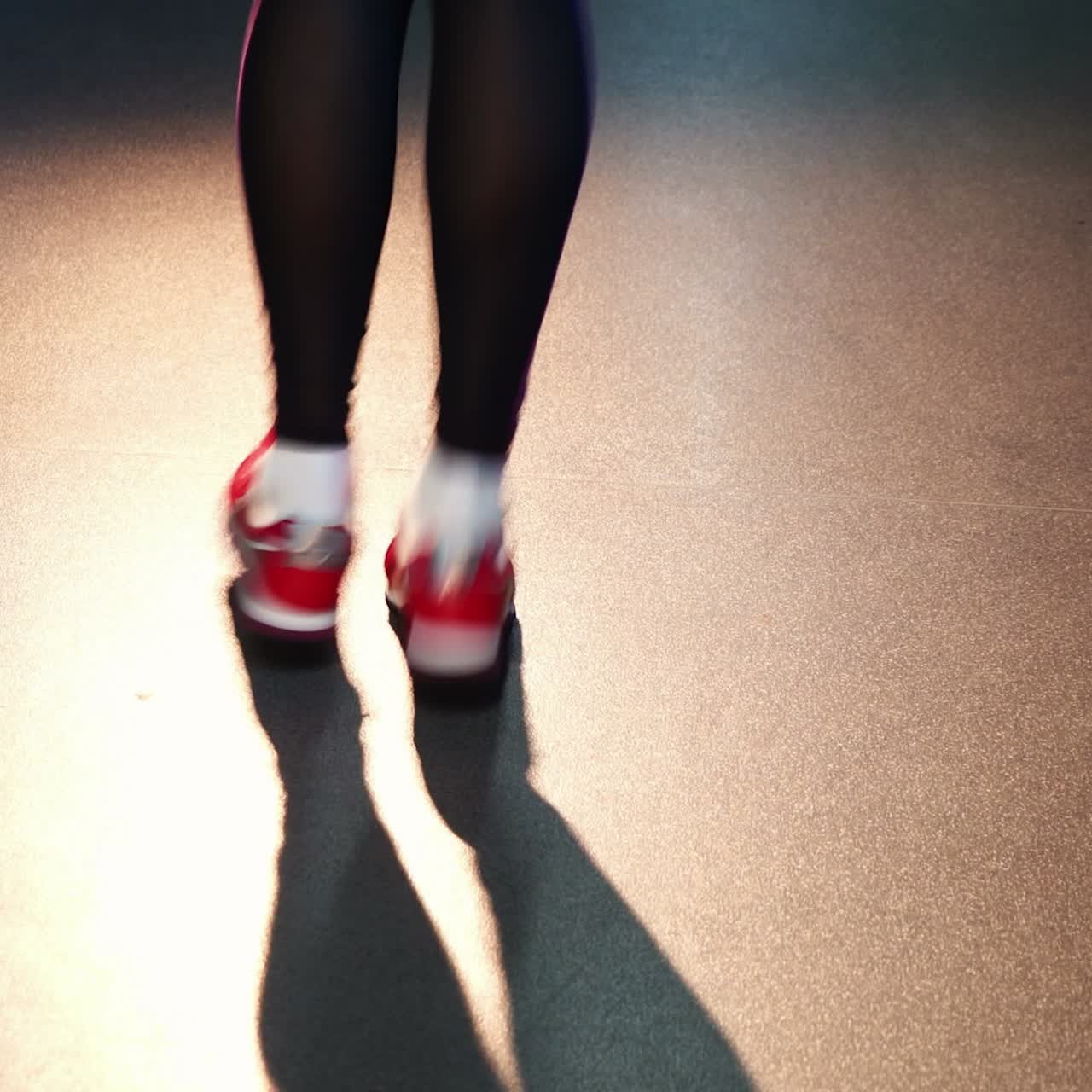 Jumping Rope. Athletic woman training hard at the gym.