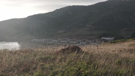 Marin-Headlands-in-Sausalito,-California,-showcasing-sweeping-views-of-rugged-hills-and-the-Pacific-Ocean-framed-by-lush-greenery-and-coastal-cliffs