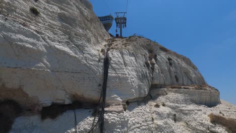 hand-held shot inside a cable car rising up the cliffs at rosh hanikra, israel