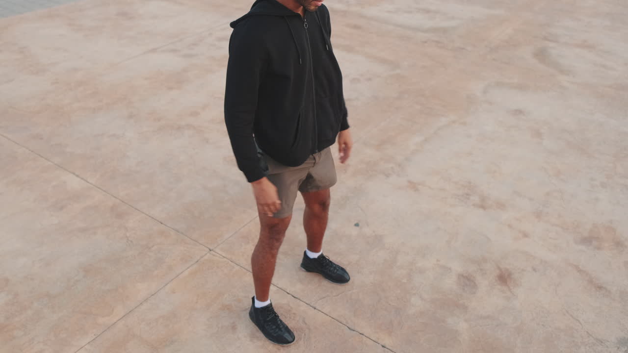 Man doing squats outdoors