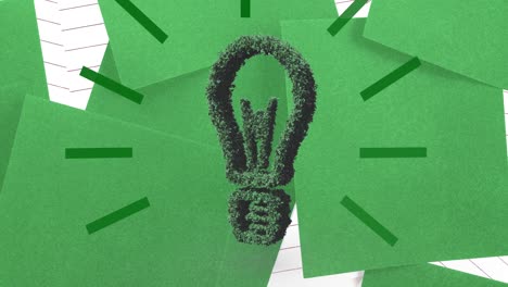 Animation-of-plant-light-bulb-over-green-and-lined-paper-background