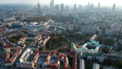 High-angle-view-of-old-town-buildings.-Tilt-up-reveal-of-skyline-with-downtown-skyscrapers-against-bright-sky.-Warsaw,-Poland