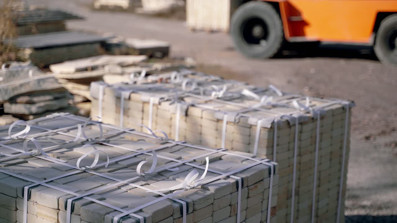 special professional equipment is transporting pallets with bricks in the production area. Warehouse equipment