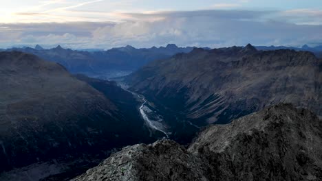 aerial flyover around munt pers near diavolezza in engadin, switzerland with a 360 view of pers and morteratsch glacier, and peaks of the swiss alps like piz bernina, piz palu