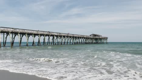 myrtle beach state park with waves under pier