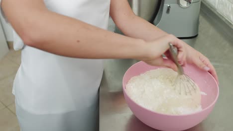 woman decorating macarons