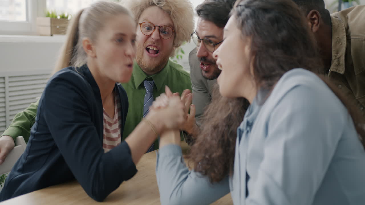 Office Friends Arm Wrestling and Hugs