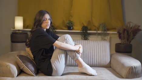 depressed young woman talking to camera.