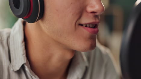 man recording podcast with headset and microphone