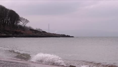 Beach-coastline-with-wave-crashing