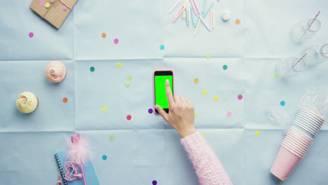 Top-view-woman-using-mobile-phone-gestures-Birthday-Party-planning-hands-from-above---Red-Epic-Dragon