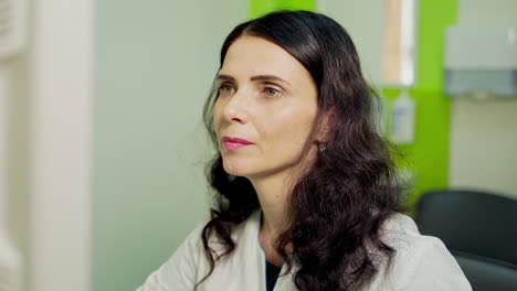 portrait of female doctor. woman specialist works in the hospital. professional doctor sitting in cabinet. medical concept.
