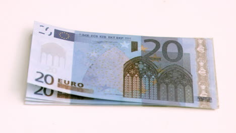 wind blowing in super slow motion on european banknotes