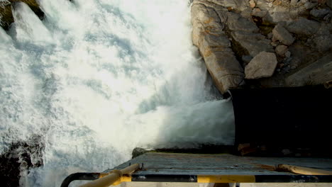 Effluents-from-large-black-plastic-pipe-being-discharged-into-ocean