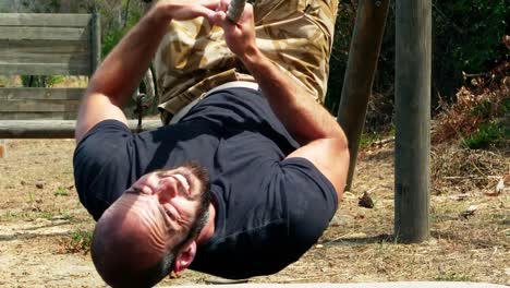 Man-crossing-the-rope-during-obstacle-course