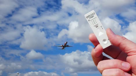 SARS-CoV-2-negative-antigen-test-showed-with-a-plane-flying-behind