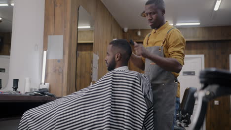 barber giving a haircut in a salon