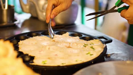 preparing traditional thai dessert on hot griddle