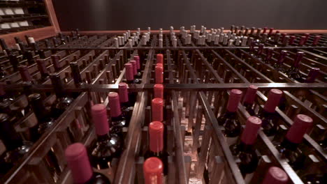 various bottles of wine stored in a wine rack, winery storage, slider up angle hd