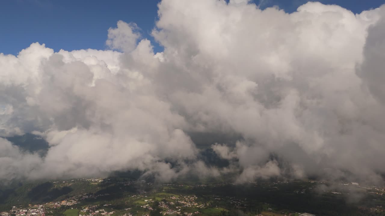 Marvel at the breathtaking beauty of a sky filled with soft, fluffy clouds.