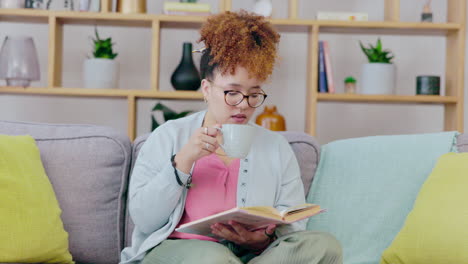 Black-woman,-reading-and-coffee-on-a-living-room