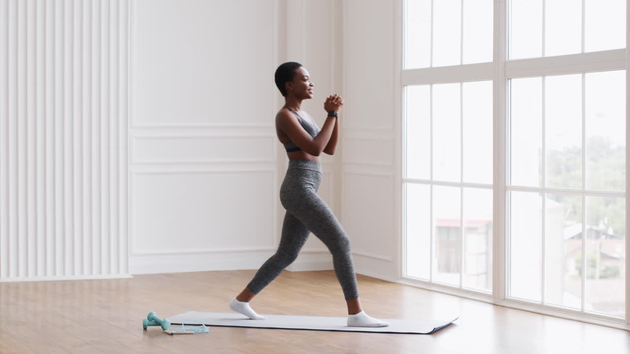 Woman Doing Lunges in a Fitness Studio