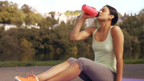 Pretty-brunette-exercising-in-park