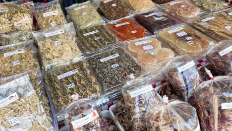 various packaged snacks displayed on a market table