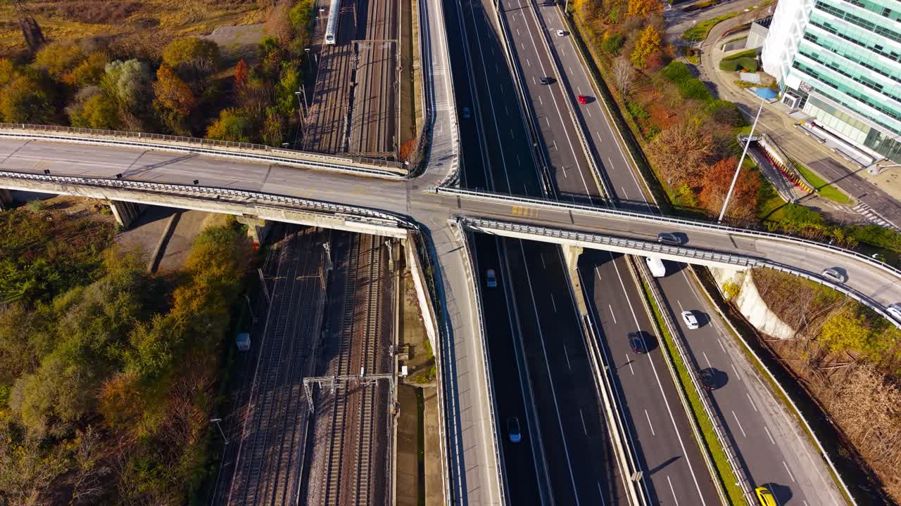 Elevated Highway Interchange Drone View. A comprehensive aerial perspective of a complex highway intersection, illustrating the smooth flow of transport. Milan, Italy