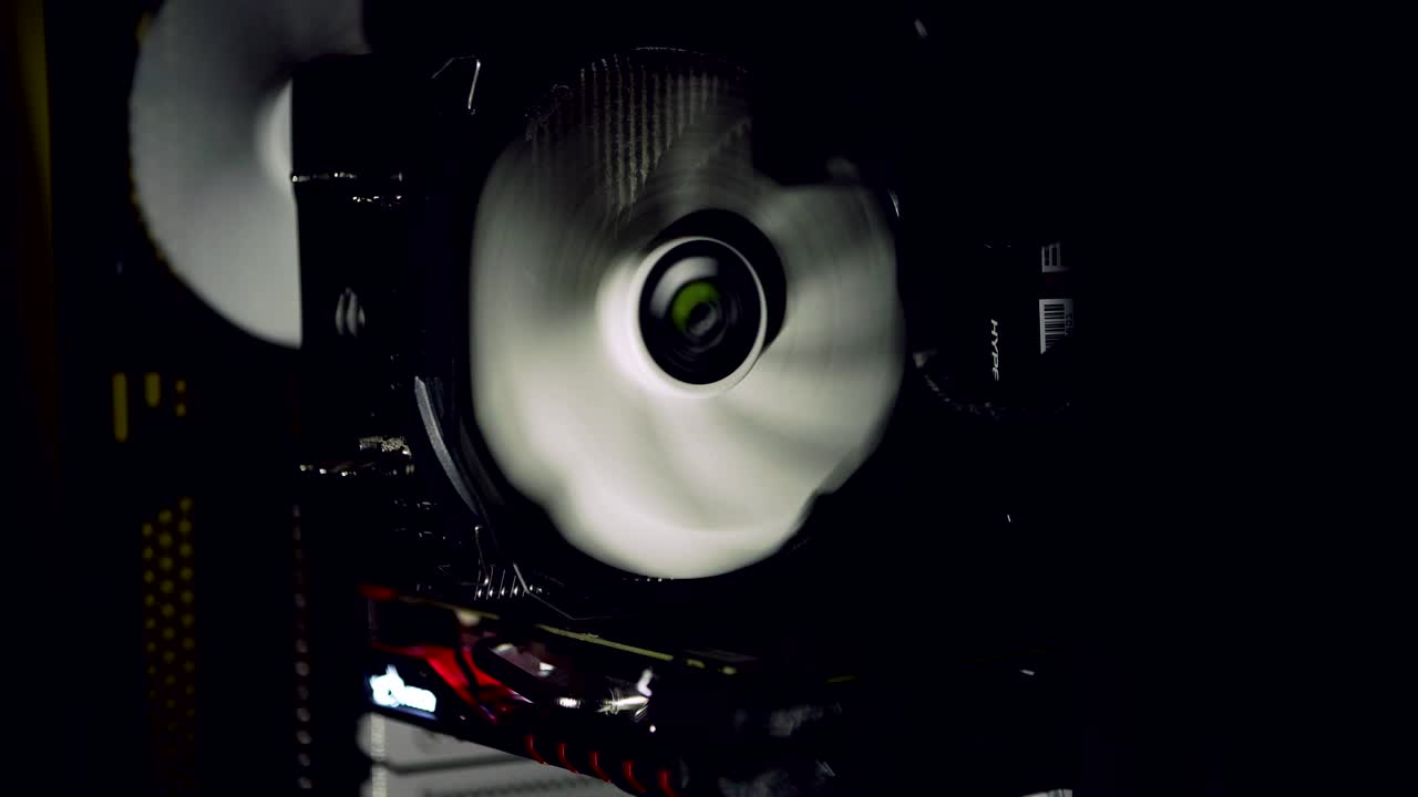 White computer fan cooling dark computer