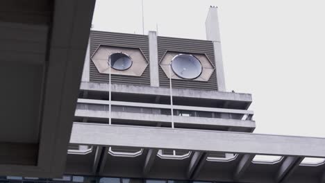 Hexagonal-windows-on-a-unique-building-facade-in-Nara,-Japan,-under-an-overcast-sky