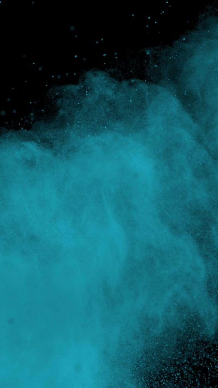 Super Slow Motion Shot of Blue Color Powder Explosion at 1000Fps Vertical View