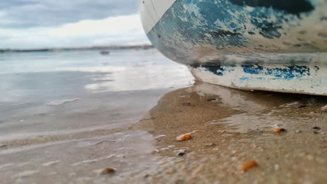 old boat bottom with waves slow motion - still shot