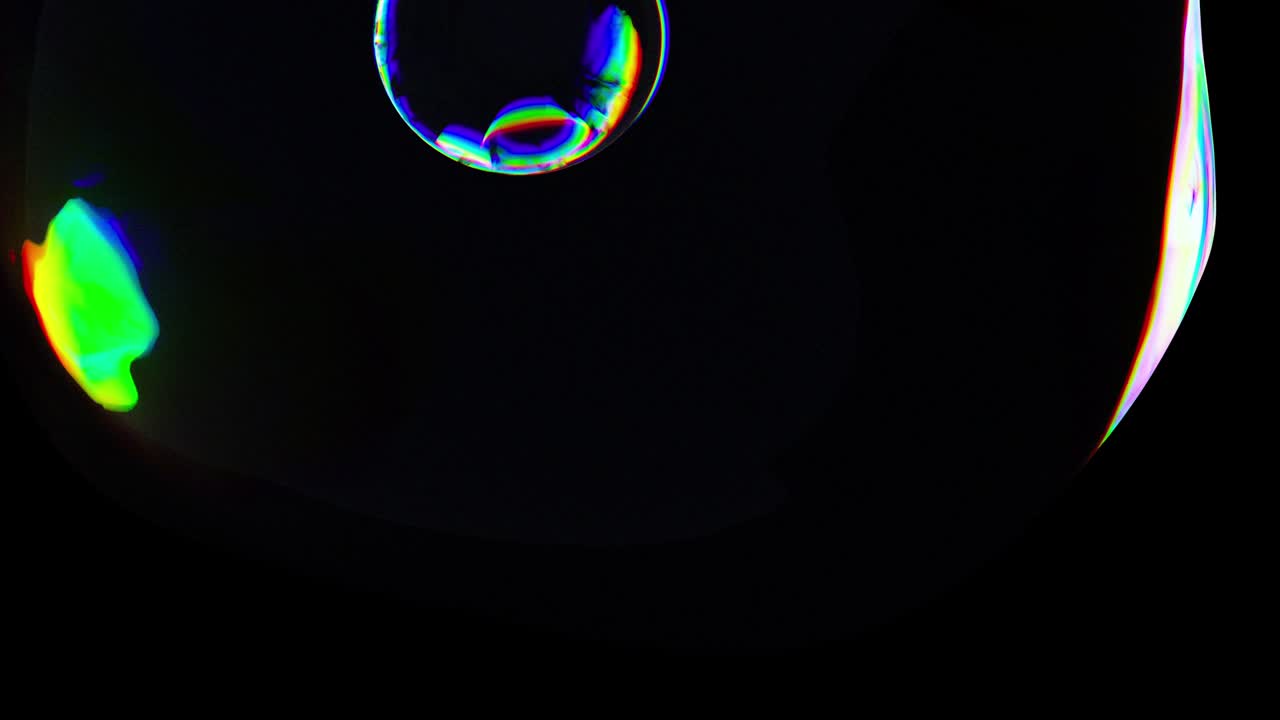 Colorful 3D Abstract Animated Background. Motion Transparent Multicolored Glass Sphere in Dark Space. Active Move Liquid Colored Bubble. Dynamic Waving Spherical Spectral Color Gradient. Concept Art