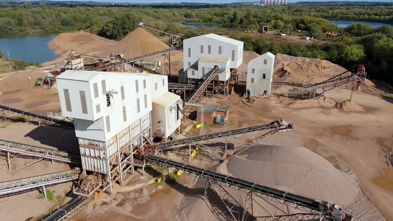 Drone video of industrial quarry near Nottingham, showing gravel grading belts and asphalt material extraction