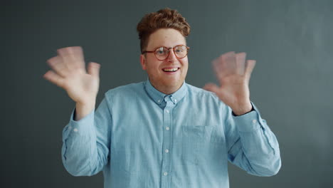 cheerful man waving